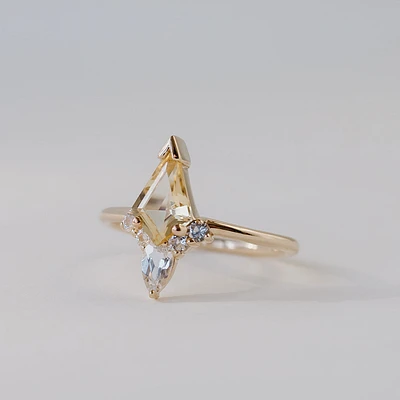 Ring with 11X7MM Honey Quartz, Round and Pear Shape White Topaz 10kt Yellow Gold