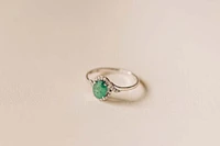 Halo Ring with .10 Carat TW of Diamonds and 7x5MM Oval Emerald 10kt White Gold