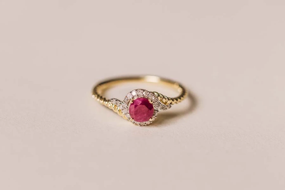 Halo Ring with .10 Carat TW of Diamonds and 5MM Ruby 10kt Yellow Gold