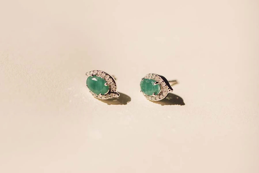 Halo Earrings with .17 Carat TW of Diamonds and 6x4MM Oval Emerald 10kt White Gold