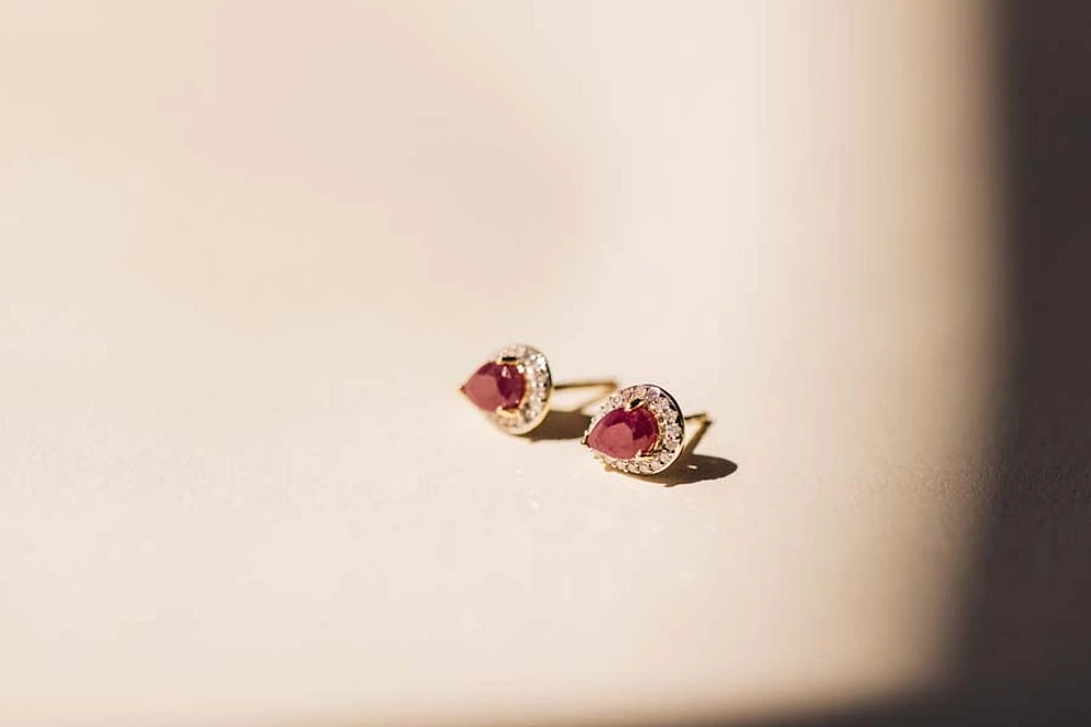 Halo Earrings with .17 Carat TW of Diamonds and 6x4MM Pear Shape Ruby 10kt Yellow Gold