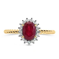 Halo Ring with .13 Carat TW of Diamonds and 7x5MM Oval Ruby 10kt Yellow Gold