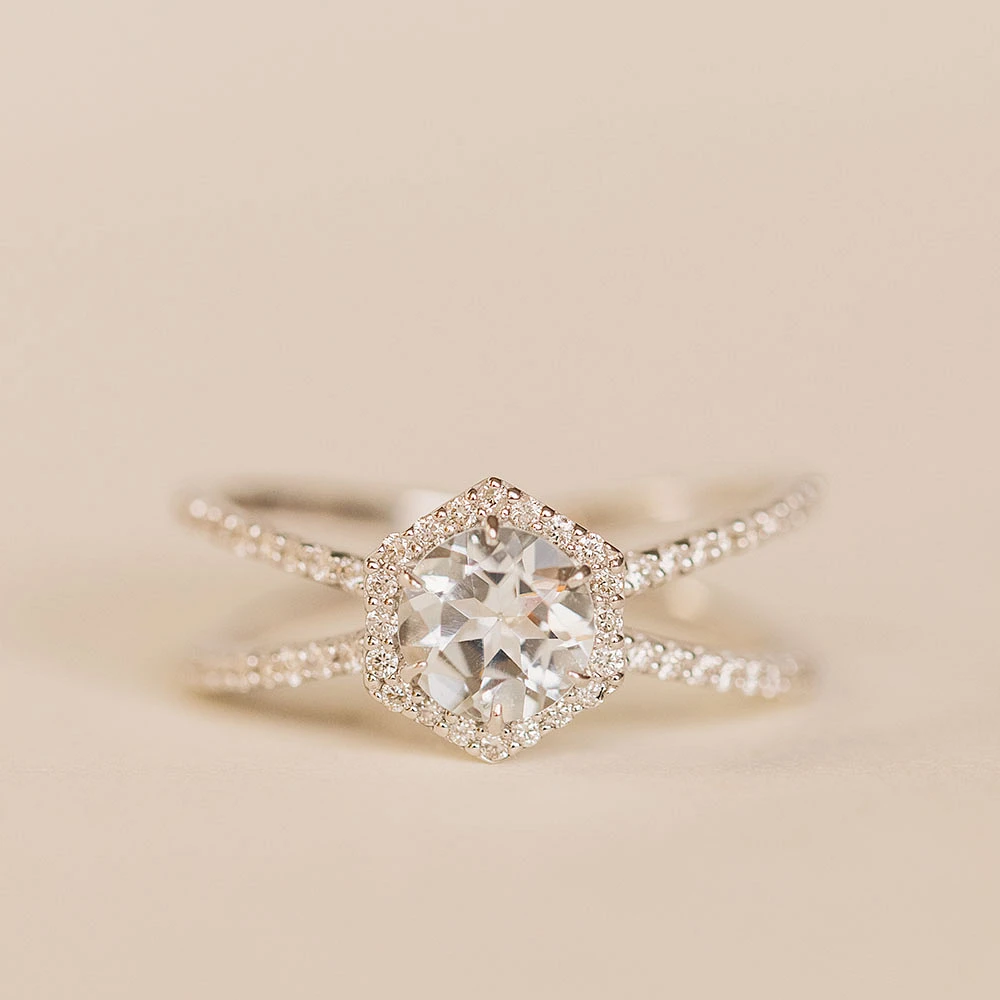 Ring with 6MM Round Aquamarine and .26 Carat TW of Diamonds in 14KT White Gold
