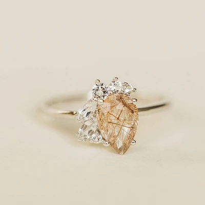 Ring with 9X6MM Pear Shape Rutilated Quartz and White Topaz in 14KT White Gold