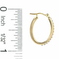 Diamond Fascination™ Medium Ribbed Oval Hoop Earrings in 14K Gold|Peoples Jewellers