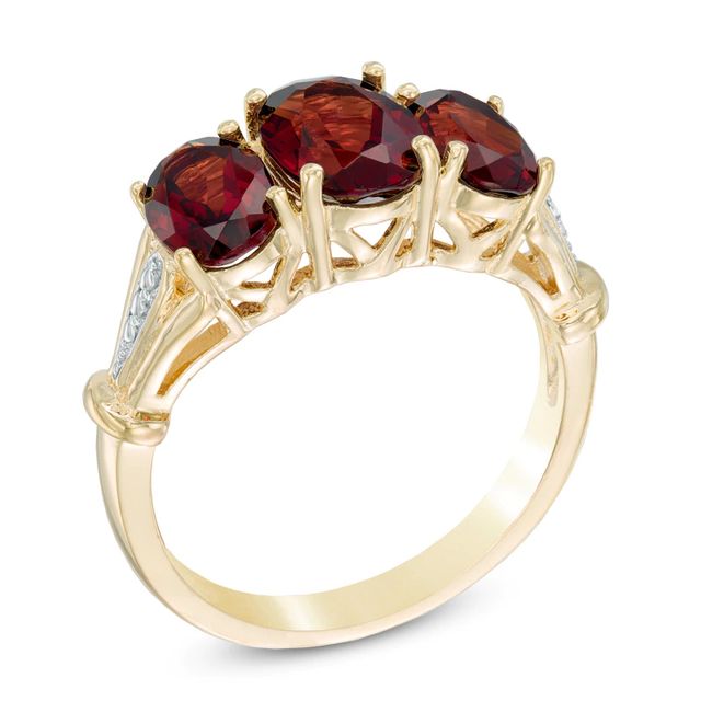 Oval Garnet and Diamond Accent Three Stone Ring in 10K Gold