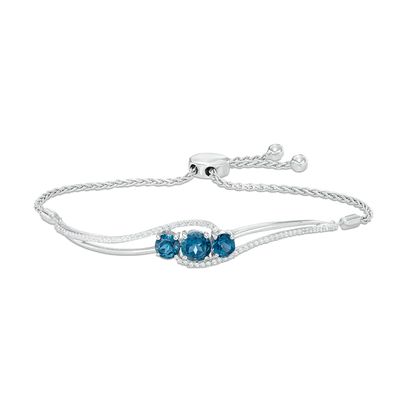 6.0mm London Blue Topaz and Lab-Created White Sapphire Three Stone Bypass Bolo Bracelet in Sterling Silver - 8.0"|Peoples Jewellers