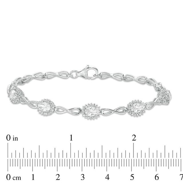 Oval Lab-Created White Sapphire Sunburst Frame and Infinity Link Bracelet in Sterling Silver - 7.5"|Peoples Jewellers