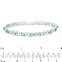 Sideways Oval Swiss Blue Topaz and Diamond Accent "XO" Bracelet in Sterling Silver - 7.25"|Peoples Jewellers