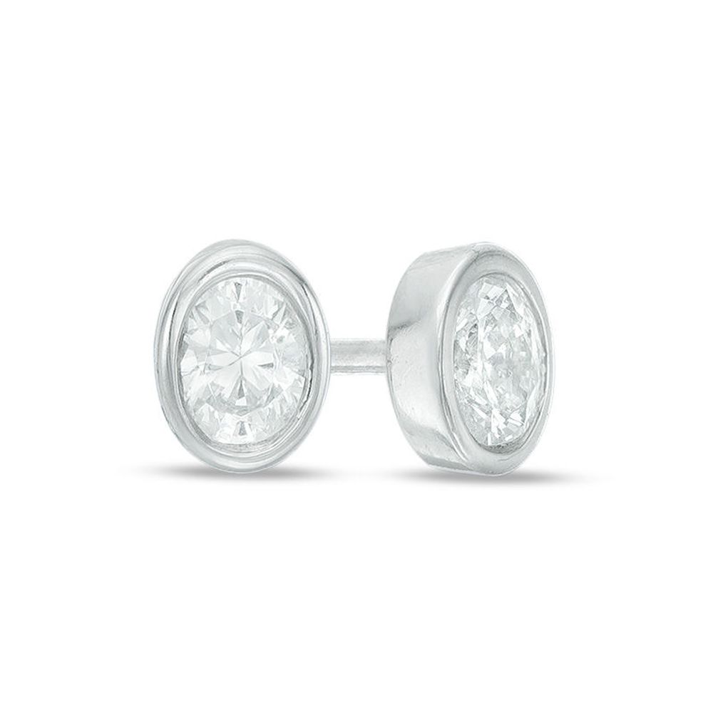 0.15 CT. T.W. Oval Diamond Solitaire Stud Earrings in 10K White Gold|Peoples Jewellers