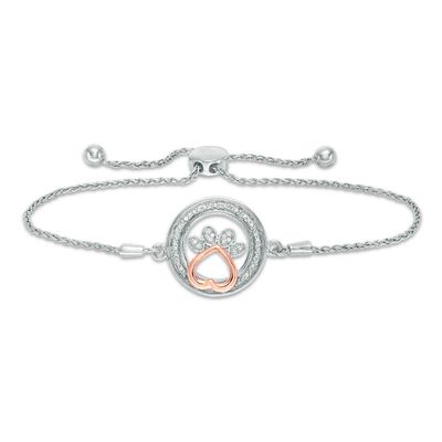 1/15 CT. T.W. Diamond Open Circle with Paw Print Bolo Bracelet in Sterling Silver and 10K Rose Gold (1 Line) - 9.5"|Peoples Jewellers