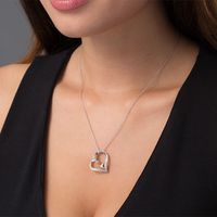 0.10 CT. T.W. Diamond Tilted Heart Within Heart Pendant in Sterling Silver and 10K Rose Gold|Peoples Jewellers