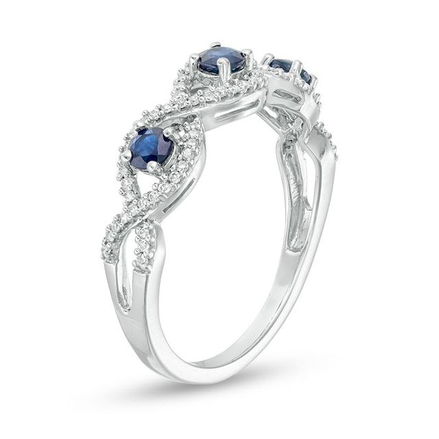 3.0mm Blue Sapphire and 0.15 CT. T.W. Diamond Three Stone Twist Shank Stackable Band in 10K White Gold