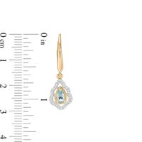 Pear-Shaped Swiss Blue Topaz and 0.18 CT. T.W. Diamond Scallop Frame Ornate Drop Earrings in 10K Gold|Peoples Jewellers