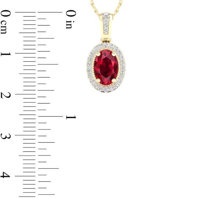 Oval Ruby and 0.08 CT. T.W. Diamond Frame Pendant in 10K Gold