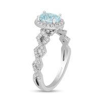 Enchanted Disney Elsa Oval Aquamarine and 0.23 CT. T.W. Diamond Frame Twist Shank Engagement Ring in 14K White Gold|Peoples Jewellers