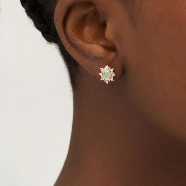 Oval Opal and 0.12 CT. T.W. Diamond Starburst Frame Vintage-Style Stud Earrings in 10K Rose Gold