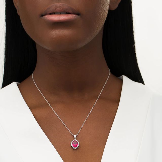 Oval Lab-Created Ruby and White Sapphire Starburst Frame Pendant in Sterling Silver|Peoples Jewellers