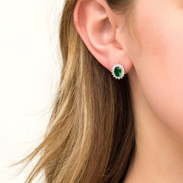Oval Lab-Created Emerald and White Sapphire Starburst Frame Stud Earrings in Sterling Silver|Peoples Jewellers