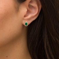 Oval Emerald and 0.07 CT. T.W. Diamond Scallop Frame Floral Stud Earrings in 10K Gold|Peoples Jewellers