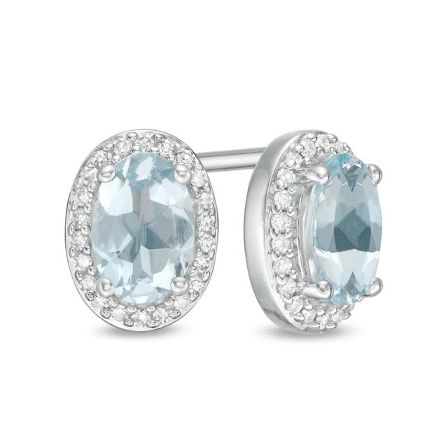 Oval Aquamarine and 0.088 CT. T.W. Diamond Frame Stud Earrings in 10K White Gold