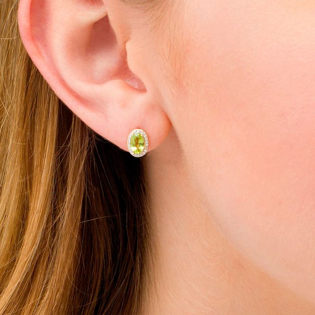 Oval Peridot and 0.088 CT. T.W. Diamond Frame Stud Earrings in 10K Gold|Peoples Jewellers