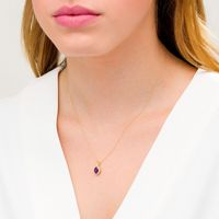 Oval Amethyst and 0.08 CT. T.W. Diamond Frame Twisted Split Bail Pendant in 10K Gold|Peoples Jewellers