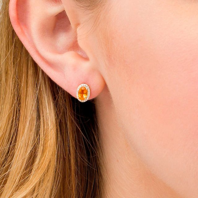 Oval Citrine and 0.088 CT. T.W. Diamond Frame Stud Earrings in 10K Gold