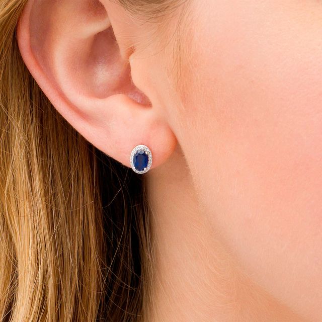 Oval Blue Sapphire and 0.088 CT. T.W. Diamond Frame Stud Earrings in 10K White Gold|Peoples Jewellers