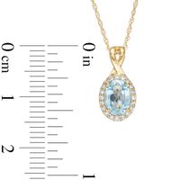 Oval Swiss Blue Topaz and 0.08 CT. T.W. Diamond Frame Twisted Split Bail Pendant in 10K Gold|Peoples Jewellers