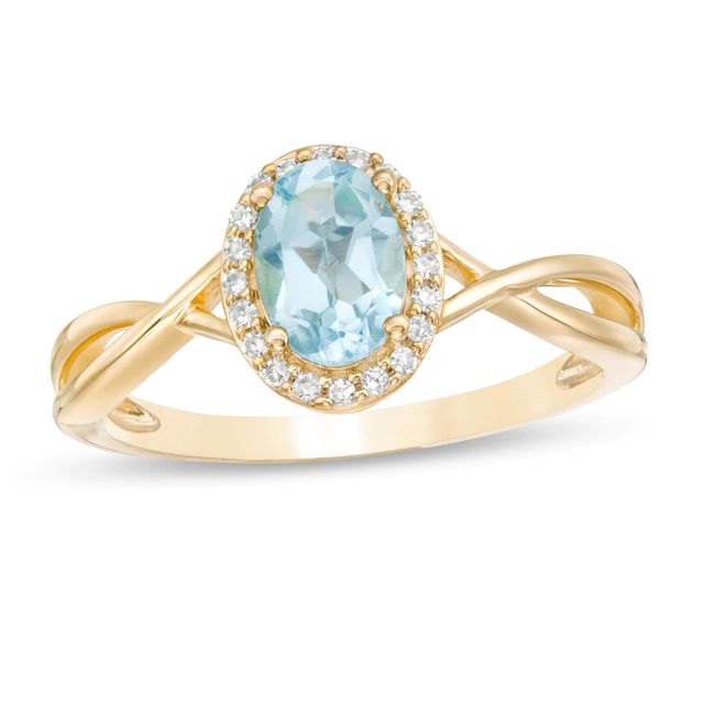 Oval Swiss Blue Topaz and 0.08 CT. T.W. Diamond Frame Twist Shank Ring in 10K Gold|Peoples Jewellers