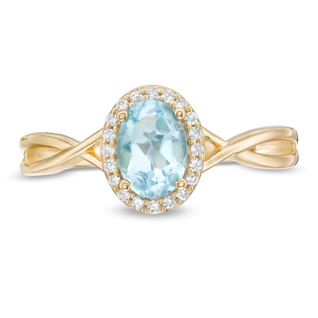 Oval Swiss Blue Topaz and 0.08 CT. T.W. Diamond Frame Twist Shank Ring in 10K Gold|Peoples Jewellers