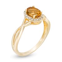 Oval Citrine and 0.08 CT. T.W. Diamond Frame Twist Shank Ring in 10K Gold|Peoples Jewellers