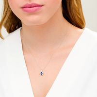 Oval Blue Sapphire and 0.08 CT. T.W. Diamond Frame Twisted Split Bail Pendant in 10K White Gold|Peoples Jewellers