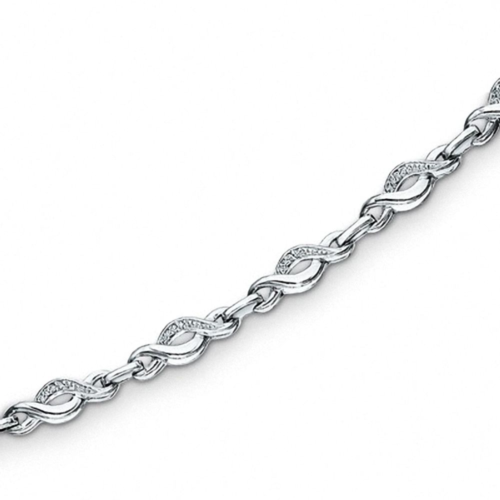 Previously Owned - 0.085 CT. T.W. Diamond Twist Bracelet in Sterling Silver - 7.25"|Peoples Jewellers