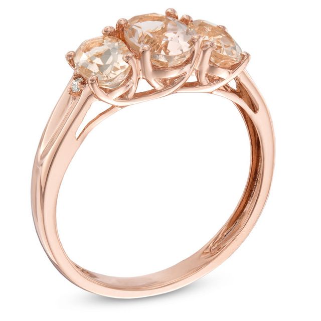 Previously Owned - Oval Morganite and Diamond Accent Three Stone Ring in 10K Rose Gold|Peoples Jewellers