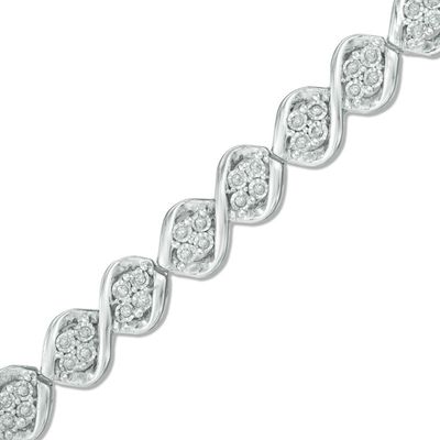 Previously Owned - 0.50 CT. T.W. Diamond Cascading Four Stone Bracelet in Sterling Silver - 7.5"|Peoples Jewellers