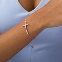 Previously Owned - 0.10 CT. T.W. Diamond Sideways Cross Bolo Bracelet in Sterling Silver - 9.5"|Peoples Jewellers