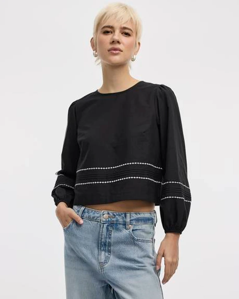 Blouse à col rond et manches longues bouffantes
