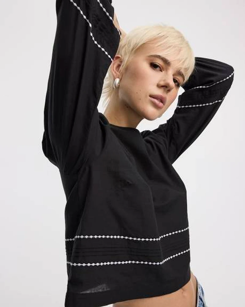 Blouse à col rond et manches longues bouffantes