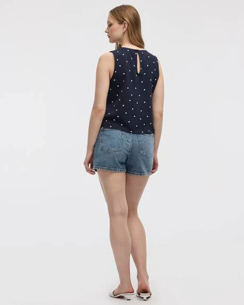 Blouse sans manches courtes avec boutons sur les côtés