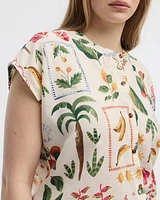 Blouse boutonnée à manches très courtes et col rond