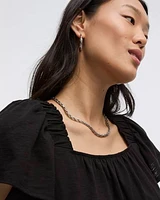 Blouse à col carré et manches courtes volants