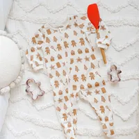 CREAM ONE-PIECE PAJAMA WITH AN ALL OVER PRINT OF COOKIES STRETCH JERSEY, BABY