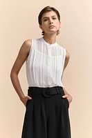 Sleeveless top with pleats