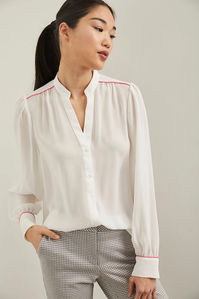 Blouse manches bouffantes à détail de passepoil
