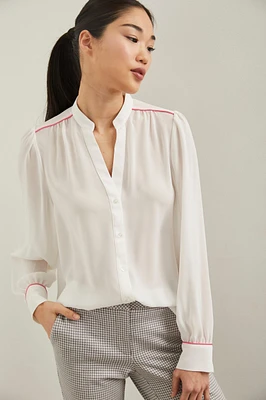 Blouse manches bouffantes à détail de passepoil
