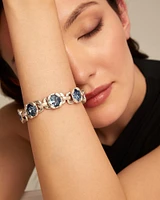 Link chain bracelet with a blue crystal