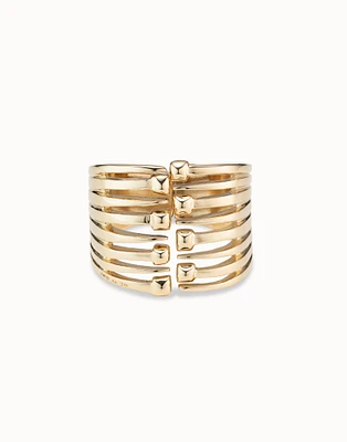 Bangle bracelet with multiple nail heads