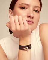 Leather bracelet with a small central link